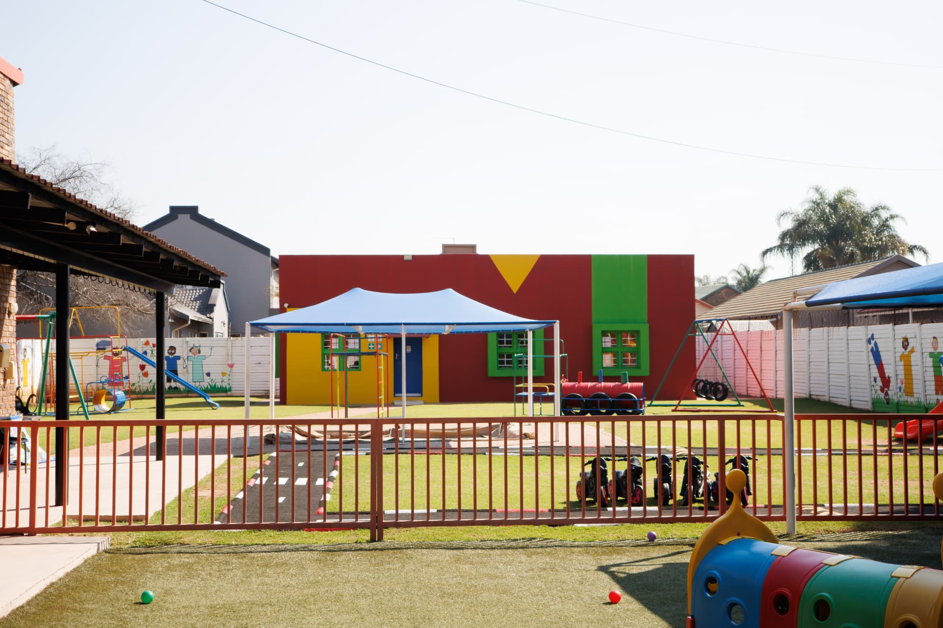 View across the school grounds with play areas and buildings