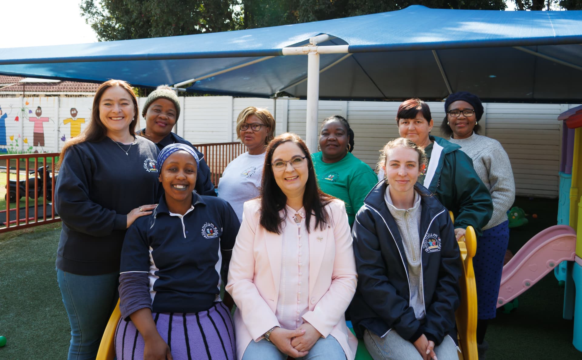 The Millennium Kids Montessori staff team outside under the shade net